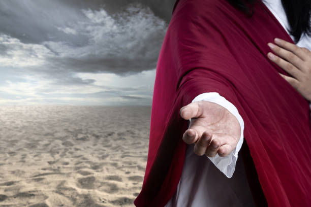 istock Jesus Christ with open palm giving helping hand 1383410336
