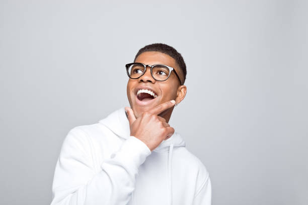 istock Portrait of excited young man 1383410401