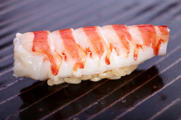 istock Semi-cooked shrimp sushi 1383411938