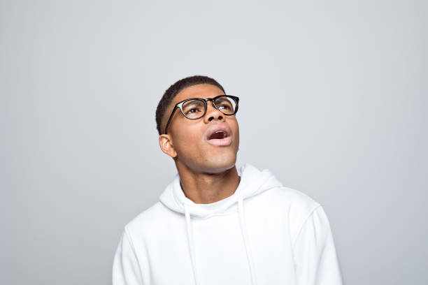 istock Portrait of surprised young man 1383411945