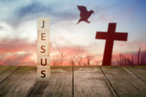 istock Wooden cube with Jesus text on wooden table 1383411999