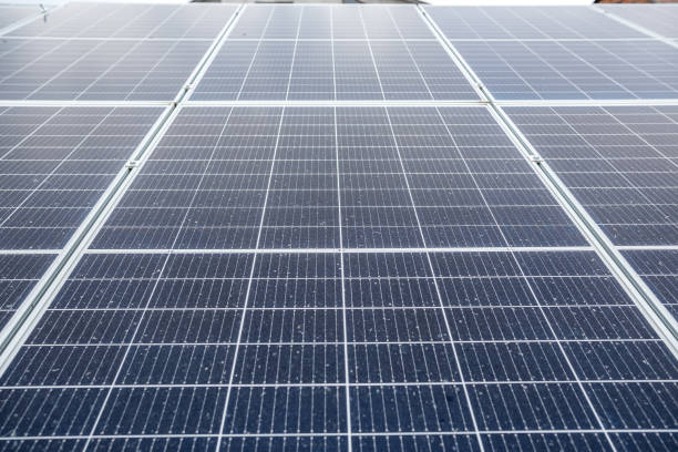 istock economical newly installed shiny solar panels that sparkle under the sky and the sun's rays. 1383417914