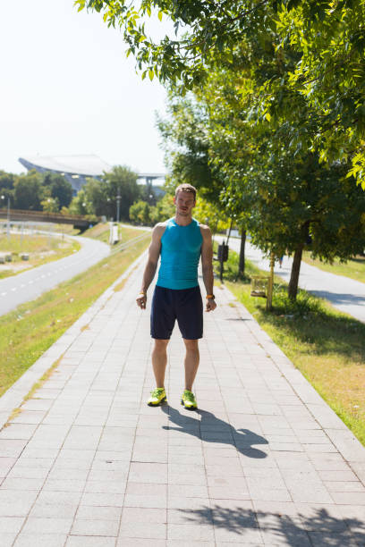 istock Man prepare to running on a track in a sunny day 1383419596