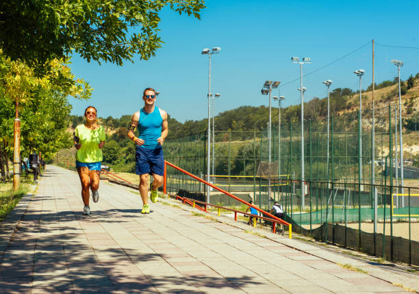 istock Young people jogging and exercising in nature 1383419613