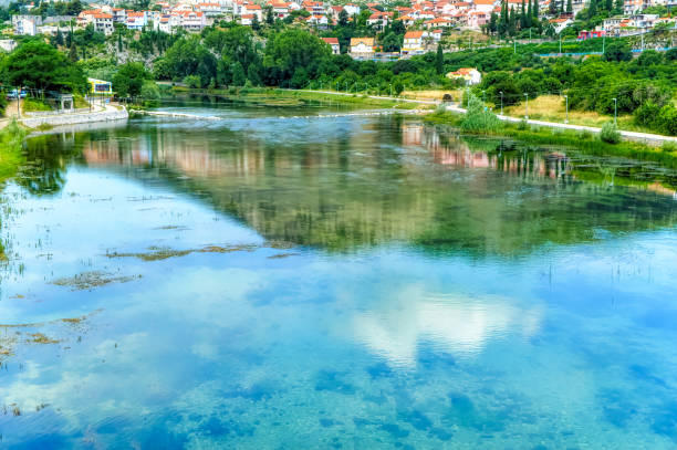 istock Trebisnjica river with various objects on its way trough city of Trebinje. 1383420943