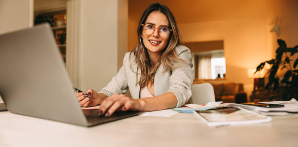 istock Creative businesswoman working in her home office 1383424404