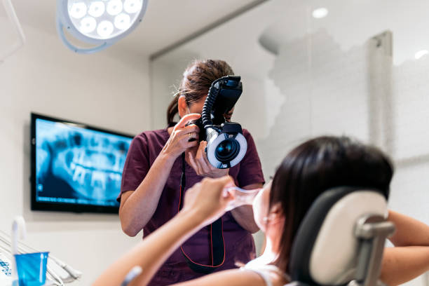 istock Female Young Dentist Taking Picture 1383427251