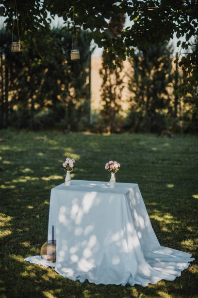istock Table setting at a luxury event and beautiful flowers on the table. Beautiful wedding arch of flowers 1383430128