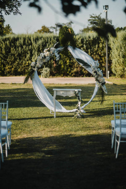 istock Table setting at a luxury event and beautiful flowers on the table. Beautiful wedding arch of flowers 1383430221