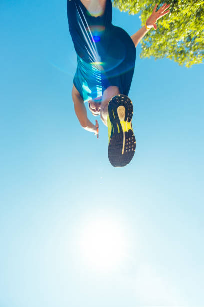 istock Running sneakers from bottom on mans leg 1383430454