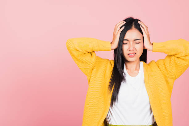 istock woman sad tired strain face holding hold head by hands 1383447319