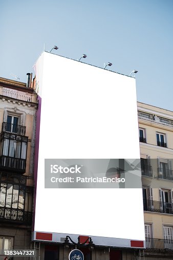 istock Blank poster on a building facade 1383447321