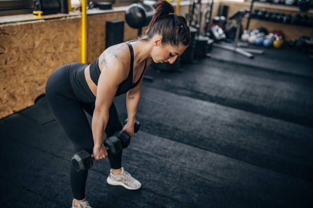 istock Woman training with dumbbells 1383462404
