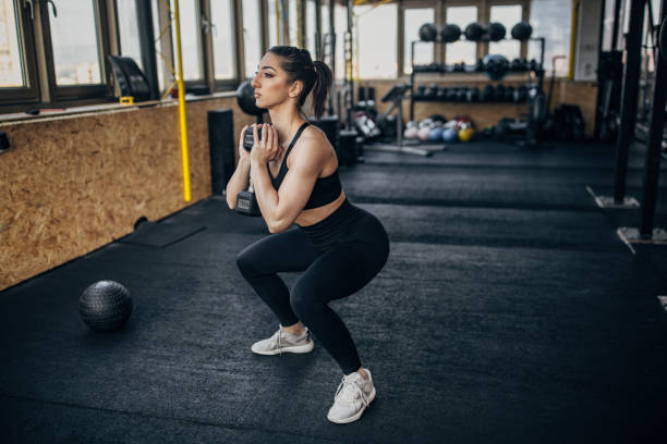 istock Woman training with dumbbell 1383462560