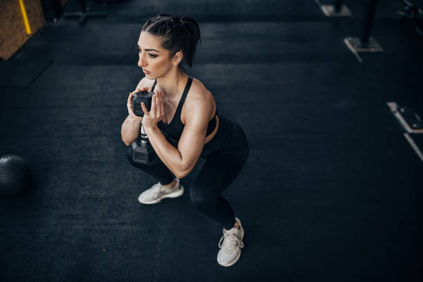 istock Woman training with dumbbell 1383462939