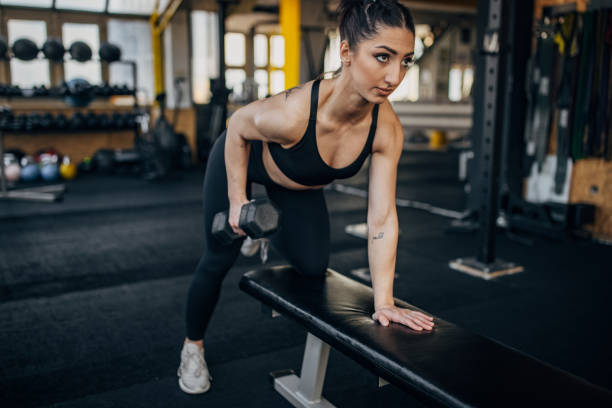 istock Woman training with dumbbell 1383463498