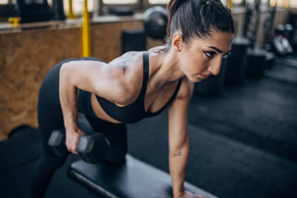 istock Woman training with dumbbell 1383464106