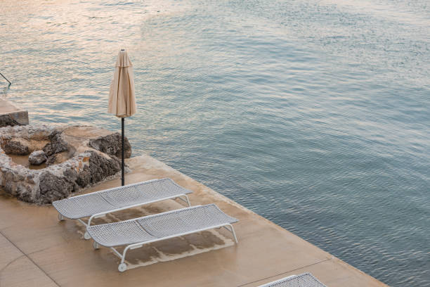istock view of empty sea beach with sun loungers 1383464107