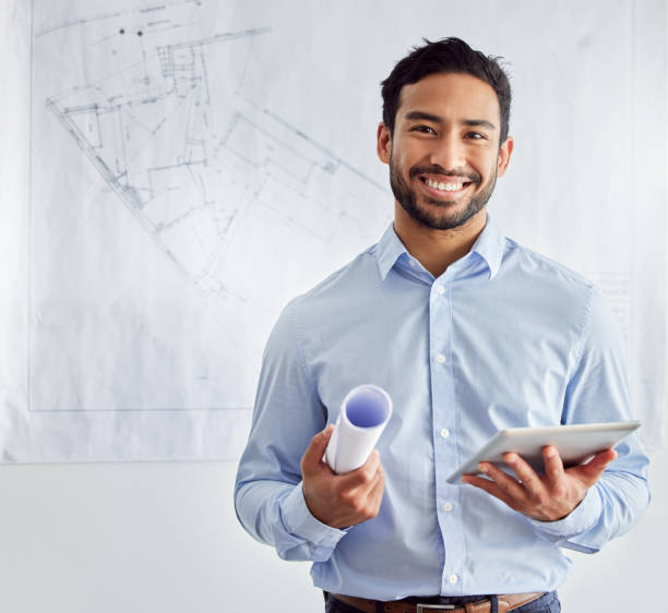 istock Shot of a young male architect using a digital tablet at work 1383468220