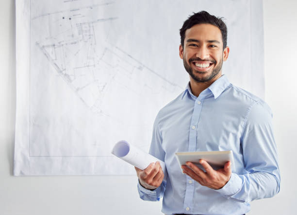 Shot of a young male architect using a digital tablet at work