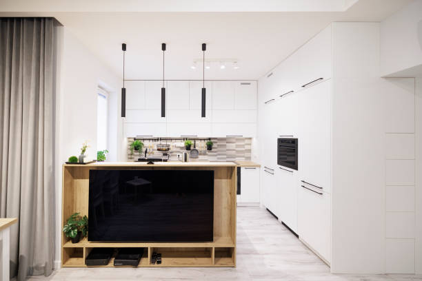 istock Modern apartment living room with open kitchen 1383470307
