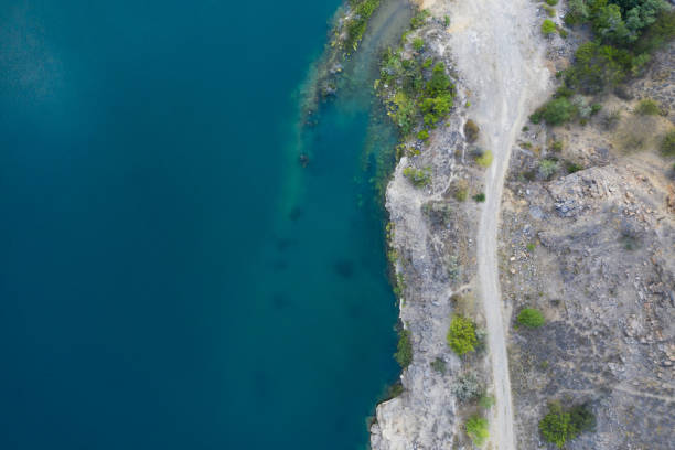 istock Beautiful blue lake with granite bank, top view 1383470403