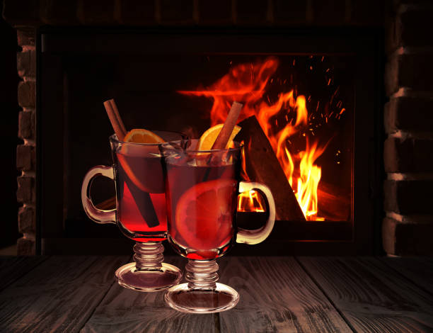 istock Mulled wine on wooden table near fireplace 1383470445