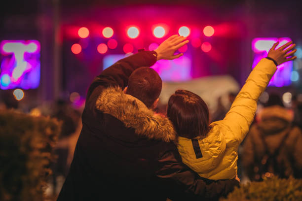 A young loving couple at a concert