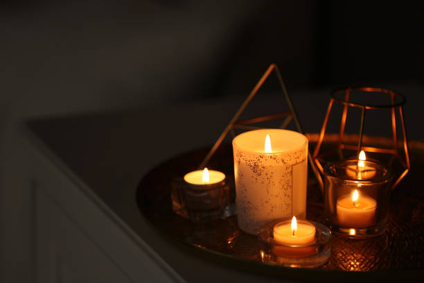 istock Beautiful burning candles and decor on table at home. Space for text 1383471312