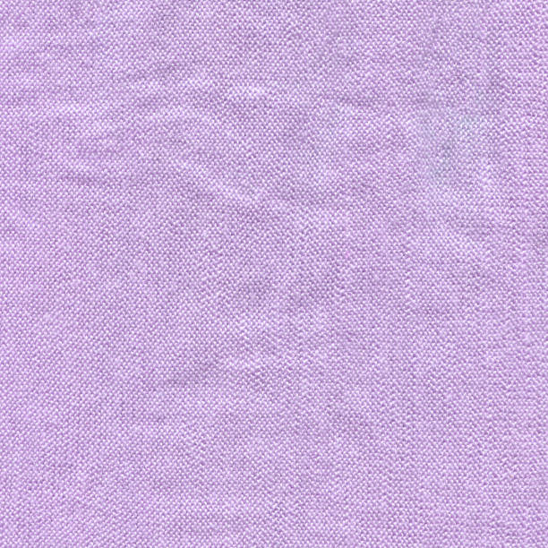 istock Violet cloth backdrop with textured effect. Knitted natural textile violet sweater texture. 1383471433