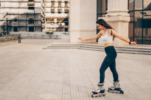 istock Smiling girl roller skating 1383471622