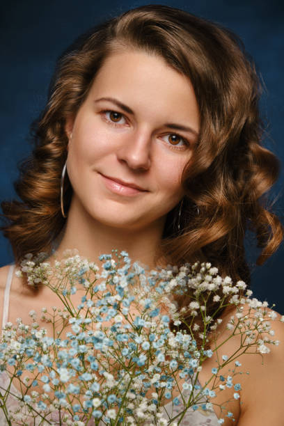 istock girl with flowers 1383472042