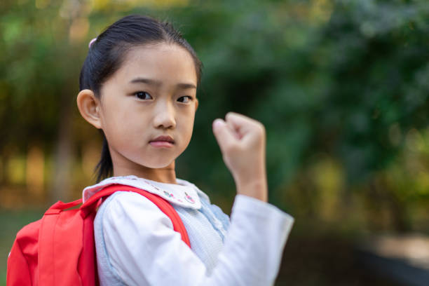 Little Girl Raised Fist Little Girl Raised Fist childrens rights stock pictures, royalty-free photos & images