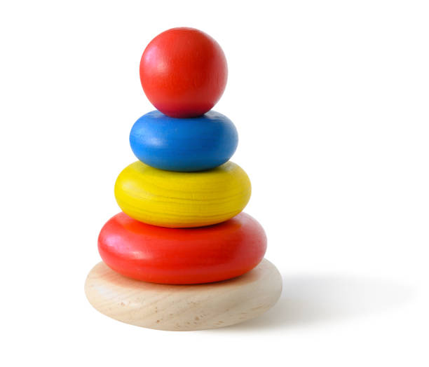 istock Toy pyramid build from colored wooden rings isolated on white background. 1383473274