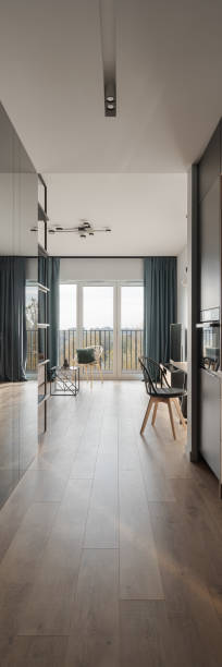 istock Long corridor in apartment, vertical panorama 1383473949
