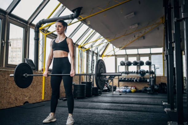 istock Fit woman weightlifting 1383476301