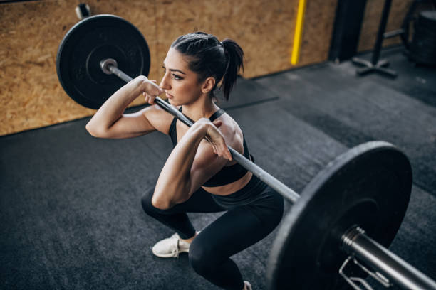 istock Fit woman exercising with weights 1383476469