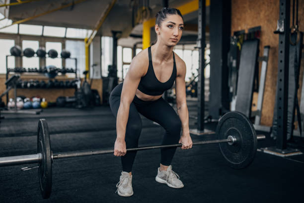 istock Fit woman weightlifting 1383476992