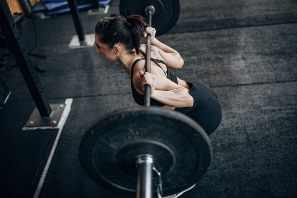 istock Fit woman exercising with weights 1383477921