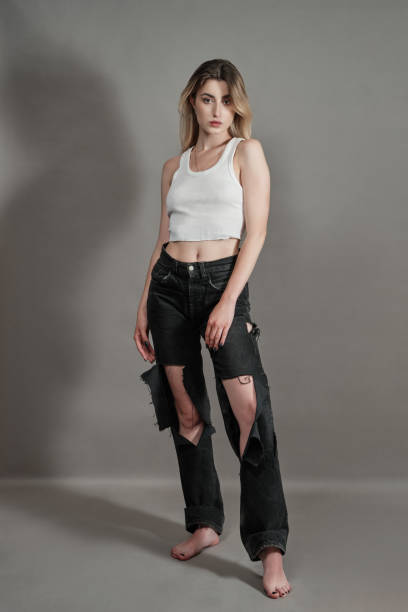 istock woman in torn jeans 1383478383