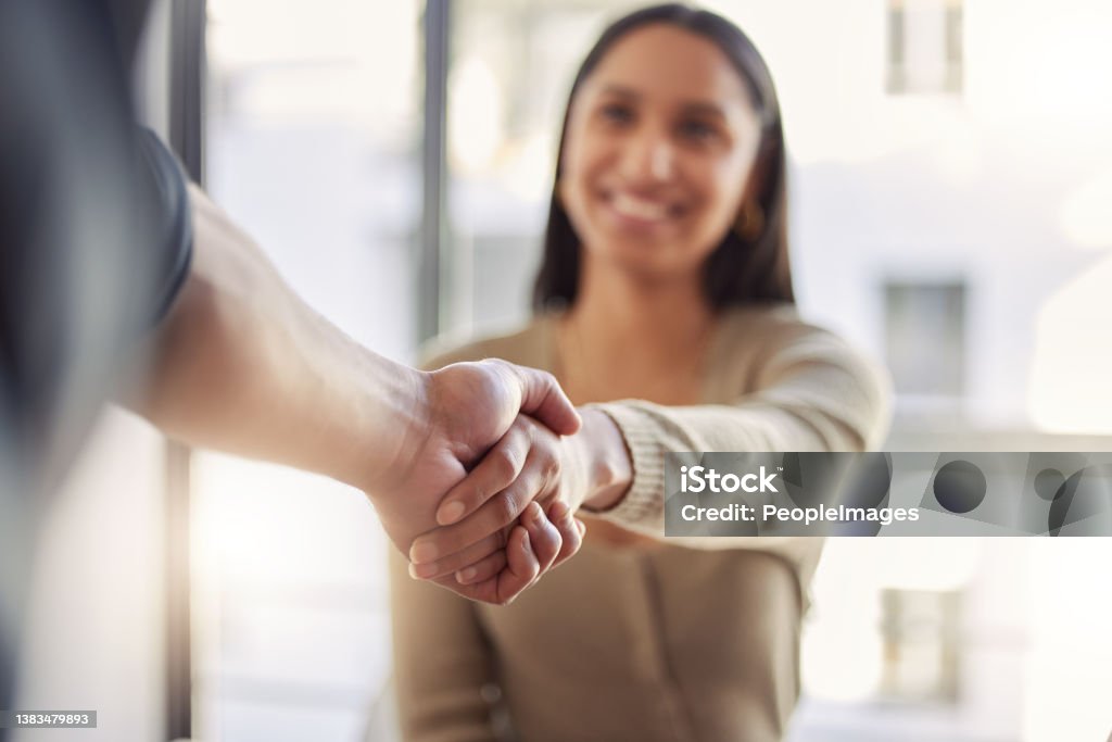 Shot of two businesspeople shaking hands at work Meeting new people Handshake Stock Photo