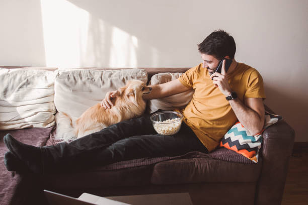 istock A man having moments of affection with his dog 1383482200