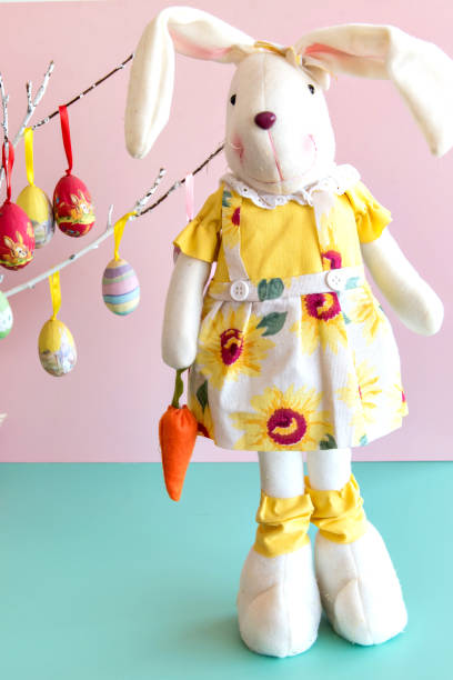 istock Plush bunny on pink and green background, easter bunny. 1383482297