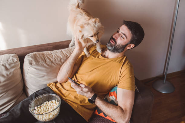 istock A man having moments of affection with his dog 1383482958