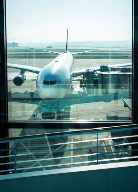 istock Airplane leaving a departure gate after boarding 1383484632