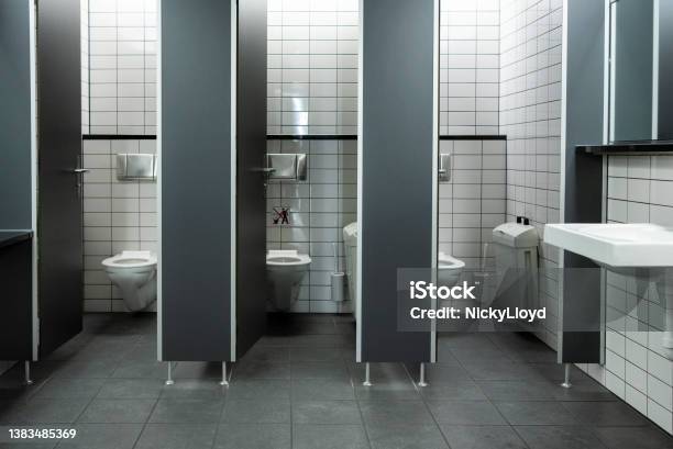 Toilet Cubicles With Open Doors In A Public Restroom Stock Photo - Download Image Now
