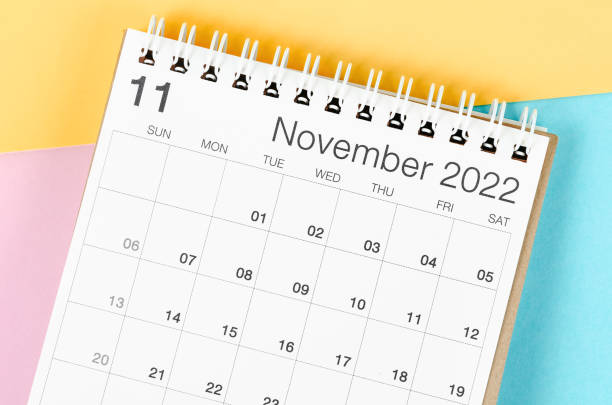 istock November 2022 desk calendar on multicolored background. 1383485704