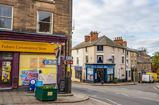 Fishers Convenience (Premier) Store of Belper in Derbyshire, England, with other shops and number plates visible
