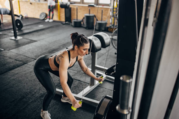 istock Woman exercising in gym 1383487078
