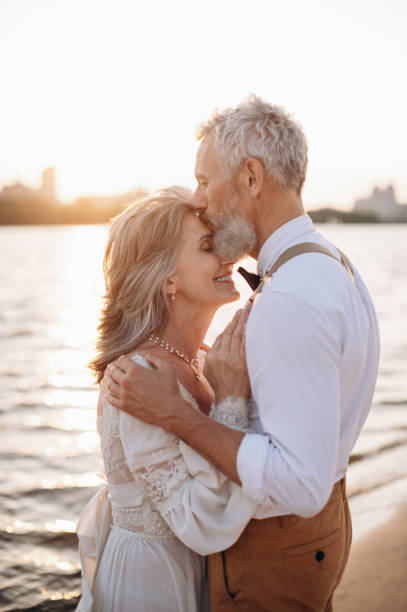 istock Senior newlyweds hug. 1383488246